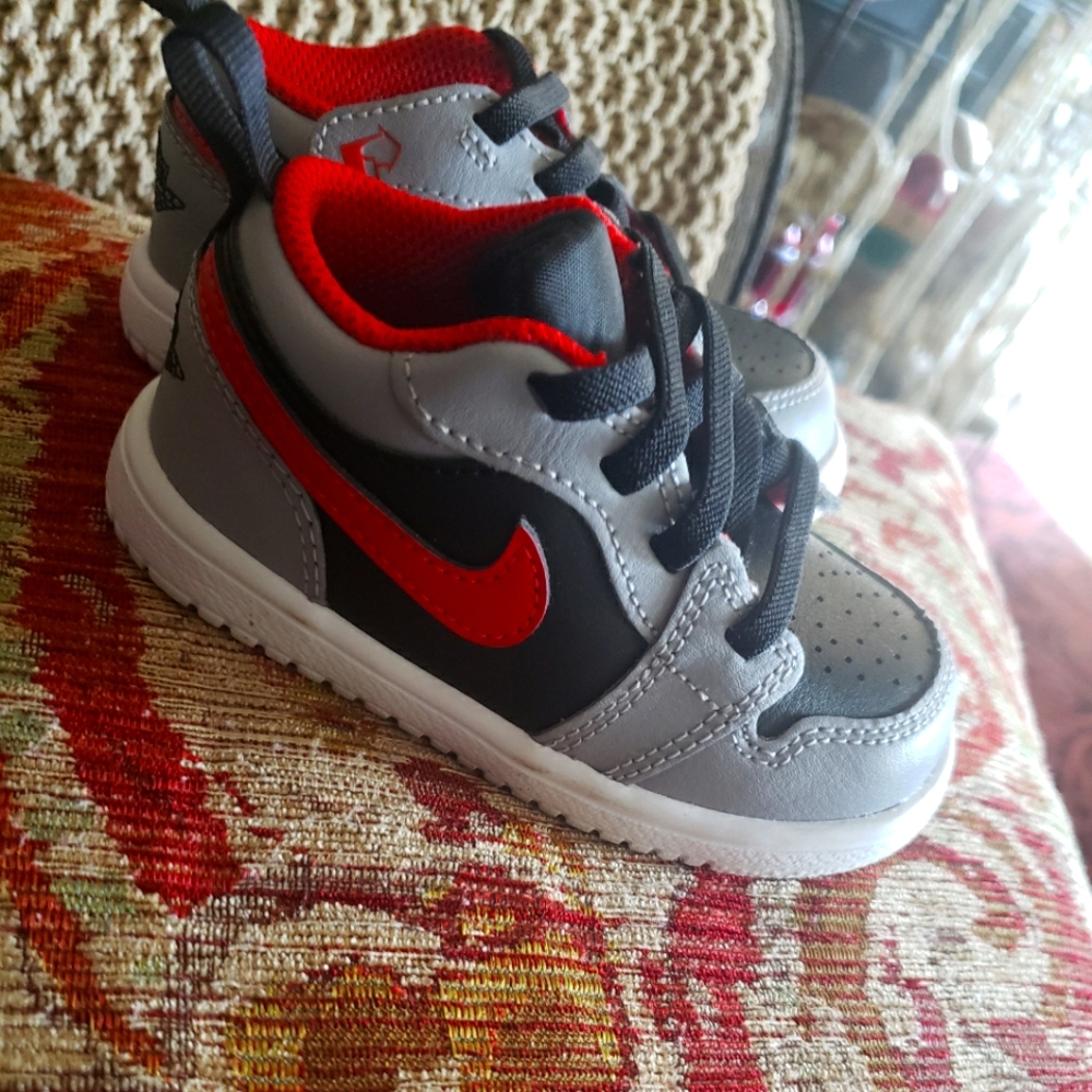 Kids Gray and Red Air Jordan Size 6c  Athletic Shoes